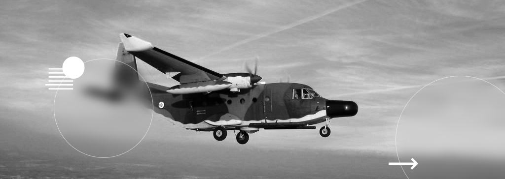 A surveillance aircraft in flight, captured against a backdrop of a blue-toned sky, showcasing its capabilities in airborne reconnaissance and monitoring operations.